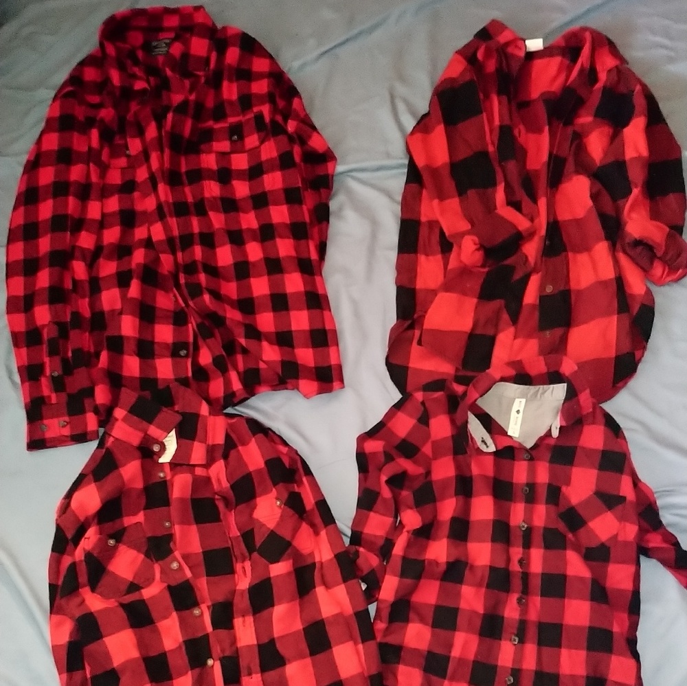 Four red and black plaid shirts
